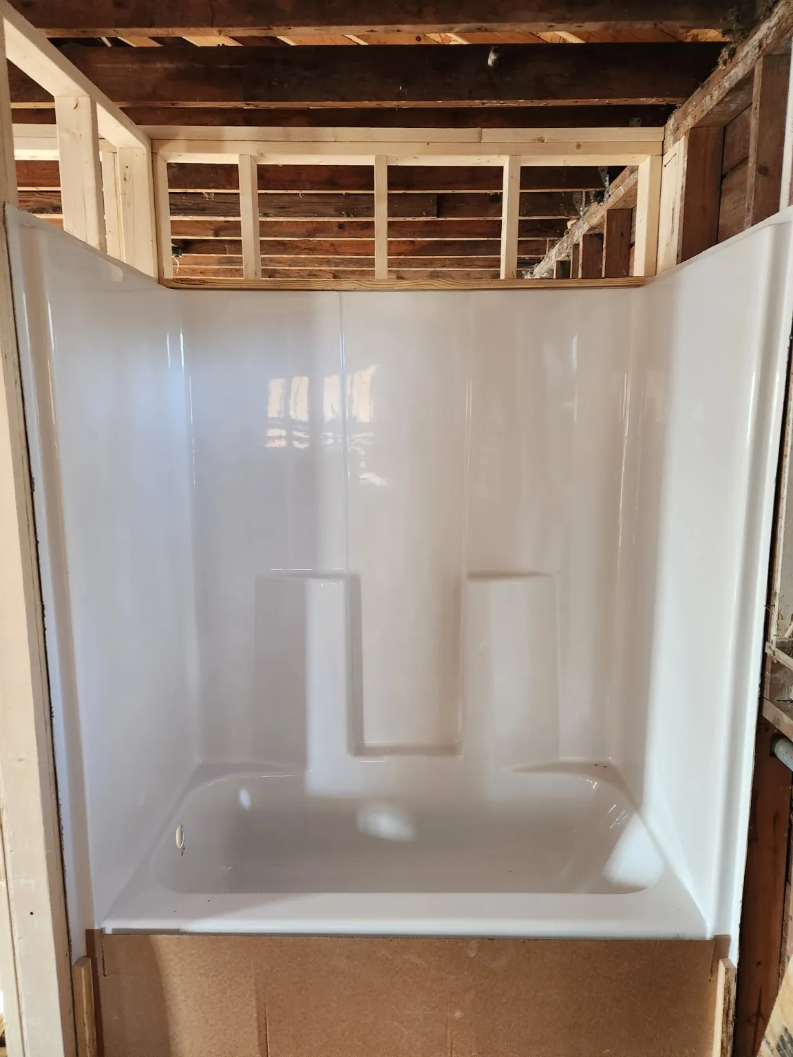 Tub and shower installation in progress